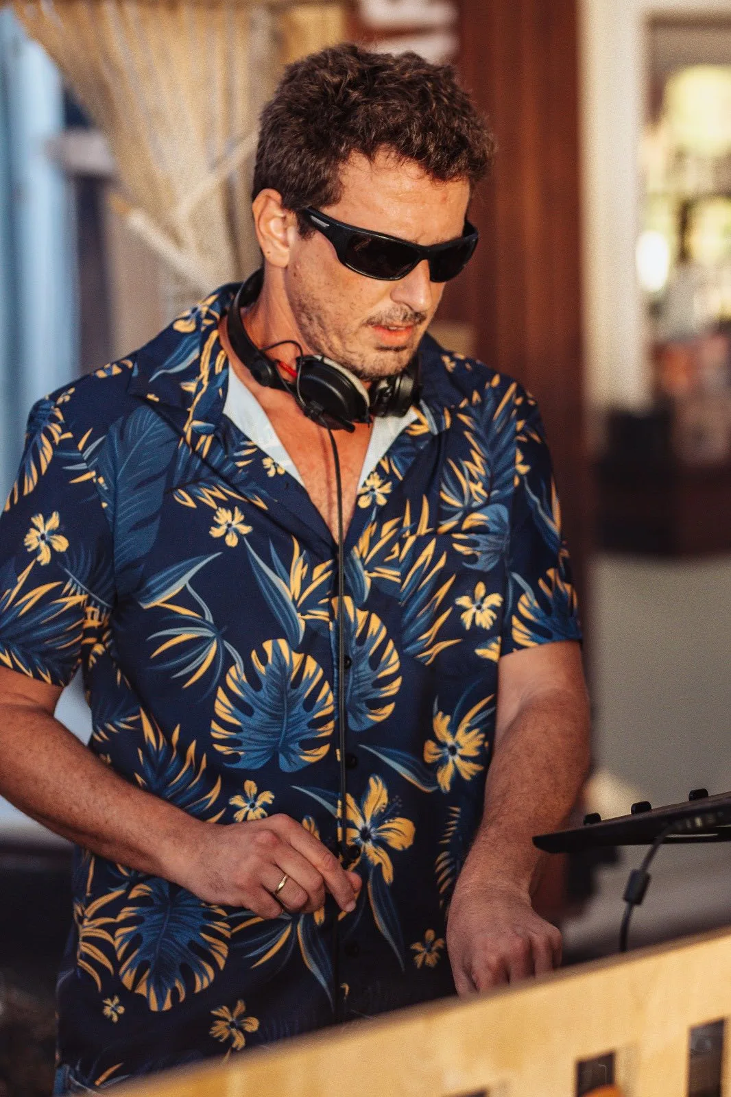 Gilad mixing music at a beach event